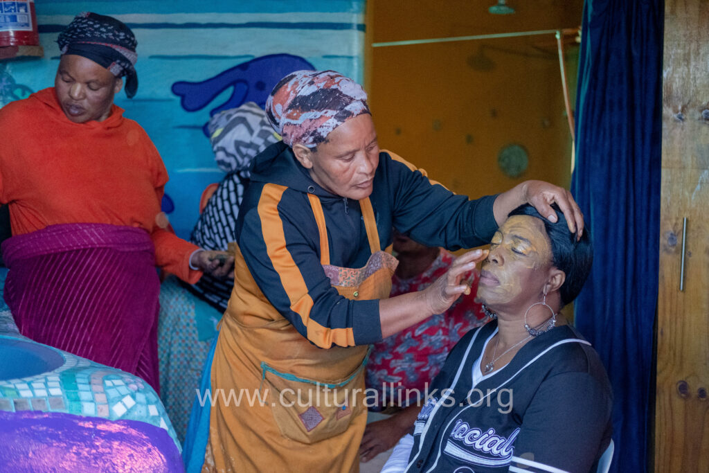 women apply clay protection 1